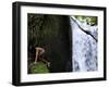 Child from the Ache Indigenous Group Plays Near a Waterfall in Cerro Moroti, Paraguay-null-Framed Photographic Print