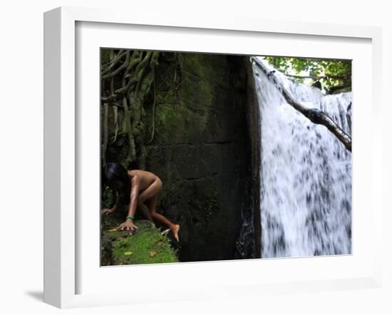 Child from the Ache Indigenous Group Plays Near a Waterfall in Cerro Moroti, Paraguay-null-Framed Photographic Print