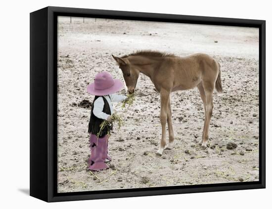 Child in Western Wear Feeding a Pony-Nora Hernandez-Framed Stretched Canvas