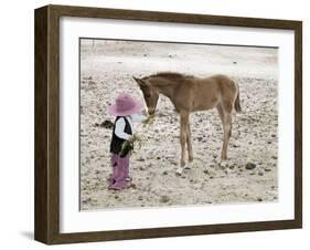 Child in Western Wear Feeding a Pony-Nora Hernandez-Framed Giclee Print