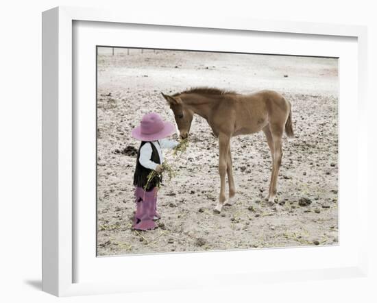 Child in Western Wear Feeding a Pony-Nora Hernandez-Framed Giclee Print