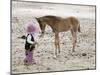 Child in Western Wear Feeding a Pony-Nora Hernandez-Mounted Giclee Print