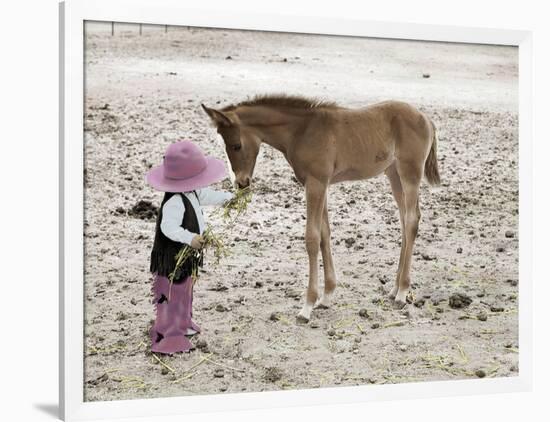 Child in Western Wear Feeding a Pony-Nora Hernandez-Framed Premium Giclee Print