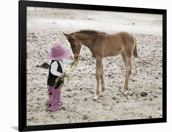 Child in Western Wear Feeding a Pony-Nora Hernandez-Framed Premium Giclee Print