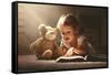Child Little Girl Reading a Magic Book in the Dark Home with a Toy Teddy Bear-evgeny atamanenko-Framed Stretched Canvas
