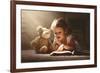 Child Little Girl Reading a Magic Book in the Dark Home with a Toy Teddy Bear-evgeny atamanenko-Framed Photographic Print