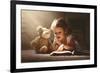 Child Little Girl Reading a Magic Book in the Dark Home with a Toy Teddy Bear-evgeny atamanenko-Framed Photographic Print