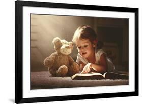 Child Little Girl Reading a Magic Book in the Dark Home with a Toy Teddy Bear-evgeny atamanenko-Framed Photographic Print