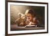 Child Little Girl Reading a Magic Book in the Dark Home with a Toy Teddy Bear-evgeny atamanenko-Framed Photographic Print