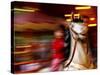 Child on Carousel at Grona Lund Amusement Park, Stockholm, Sweden-Nancy & Steve Ross-Stretched Canvas