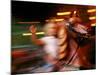 Child on Carousel at Grona Lund Amusement Park, Stockholm, Sweden-Nancy & Steve Ross-Mounted Photographic Print