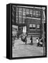 Child on Swings in Playground at the KLH Day Care Center-Leonard Mccombe-Framed Stretched Canvas