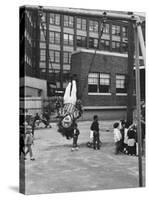 Child on Swings in Playground at the KLH Day Care Center-Leonard Mccombe-Stretched Canvas