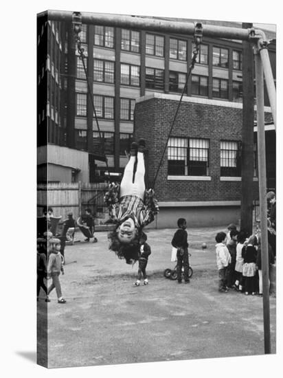 Child on Swings in Playground at the KLH Day Care Center-Leonard Mccombe-Stretched Canvas