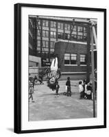 Child on Swings in Playground at the KLH Day Care Center-Leonard Mccombe-Framed Photographic Print