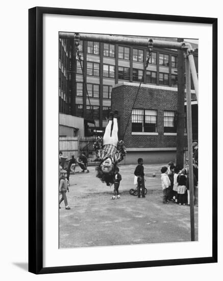 Child on Swings in Playground at the KLH Day Care Center-Leonard Mccombe-Framed Photographic Print