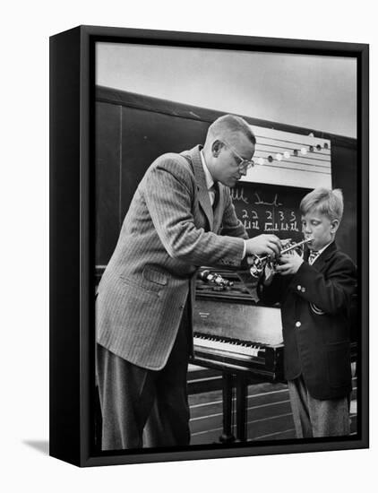 Child Playing Various Musical Instruments-Nina Leen-Framed Stretched Canvas