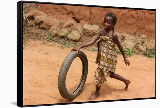 Child playing with a tyre, Tori, Benin-Godong-Framed Stretched Canvas