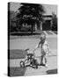 Child Playing with Tricycle-Alfred Eisenstaedt-Stretched Canvas