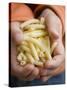 Child's Hands Holding Macaroni-null-Stretched Canvas