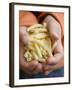 Child's Hands Holding Macaroni-null-Framed Photographic Print