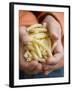 Child's Hands Holding Macaroni-null-Framed Photographic Print