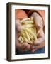 Child's Hands Holding Macaroni-null-Framed Photographic Print