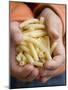 Child's Hands Holding Macaroni-null-Mounted Photographic Print