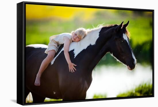 Child Sits On A Horse In Meadow Near Small River-Alexia Khruscheva-Framed Stretched Canvas