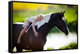 Child Sits On A Horse In Meadow Near Small River-Alexia Khruscheva-Framed Stretched Canvas