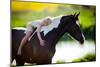 Child Sits On A Horse In Meadow Near Small River-Alexia Khruscheva-Mounted Photographic Print