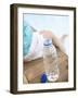 Child Sitting Beside Bottle of Water on Edge of Pool-null-Framed Photographic Print