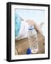 Child Sitting Beside Bottle of Water on Edge of Pool-null-Framed Photographic Print