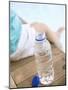 Child Sitting Beside Bottle of Water on Edge of Pool-null-Mounted Photographic Print