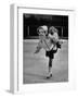 Child Skater Helen Ann Rousselle Holding Doll While Skating across the Ice-null-Framed Photographic Print