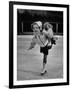 Child Skater Helen Ann Rousselle Holding Doll While Skating across the Ice-null-Framed Photographic Print