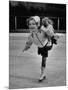 Child Skater Helen Ann Rousselle Holding Doll While Skating across the Ice-null-Mounted Photographic Print