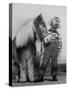 Child Standing Beside a Miniature Horse, Showing Size Comparison-Ed Clark-Stretched Canvas