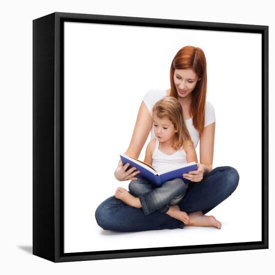 Childhood, Parenting and Relationship Concept - Happy Mother with Adorable Little Girl Reading Book-dolgachov-Framed Stretched Canvas