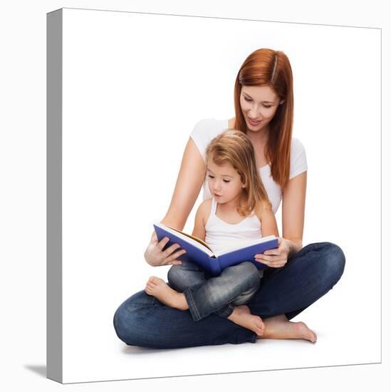 Childhood, Parenting and Relationship Concept - Happy Mother with Adorable Little Girl Reading Book-dolgachov-Stretched Canvas