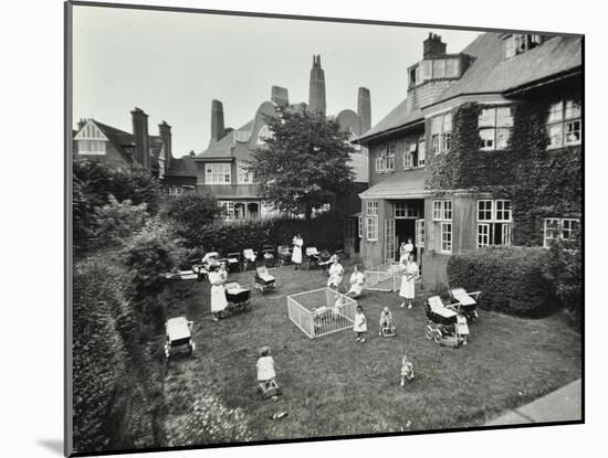 Children and Carers in a Garden, Hampstead, London, 1960-null-Mounted Photographic Print