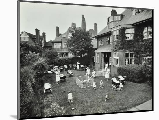 Children and Carers in a Garden, Hampstead, London, 1960-null-Mounted Photographic Print