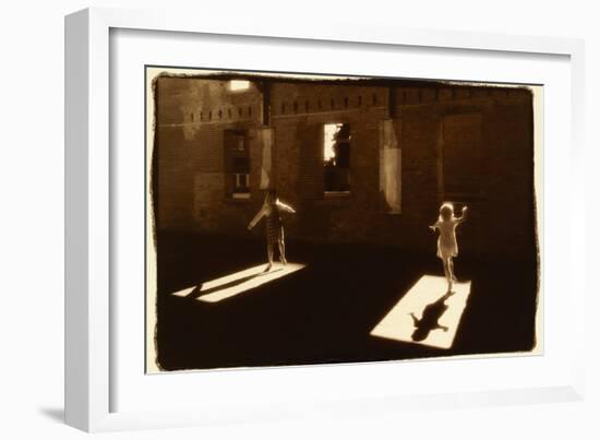 Children dancing in shafts of light-Theo Westenberger-Framed Photographic Print