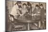 'Children emptying their money-boxes to invest in war loan', c1917, (1935)-Unknown-Mounted Photographic Print