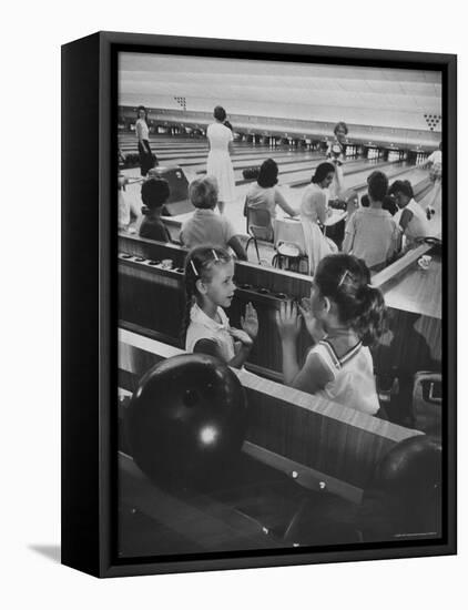 Children Entertaining Themselves While Their Mothers Compete in Bowling League-Stan Wayman-Framed Stretched Canvas