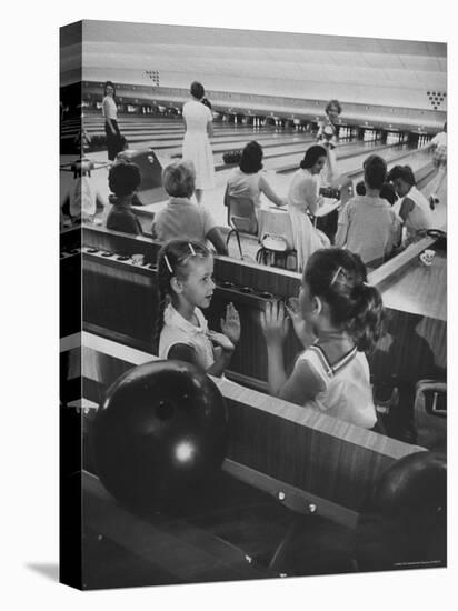 Children Entertaining Themselves While Their Mothers Compete in Bowling League-Stan Wayman-Stretched Canvas