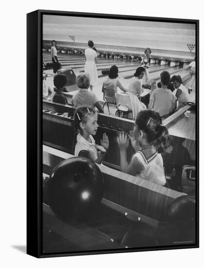 Children Entertaining Themselves While Their Mothers Compete in Bowling League-Stan Wayman-Framed Stretched Canvas