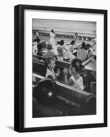 Children Entertaining Themselves While Their Mothers Compete in Bowling League-Stan Wayman-Framed Photographic Print