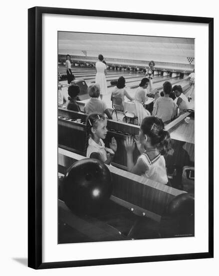 Children Entertaining Themselves While Their Mothers Compete in Bowling League-Stan Wayman-Framed Photographic Print