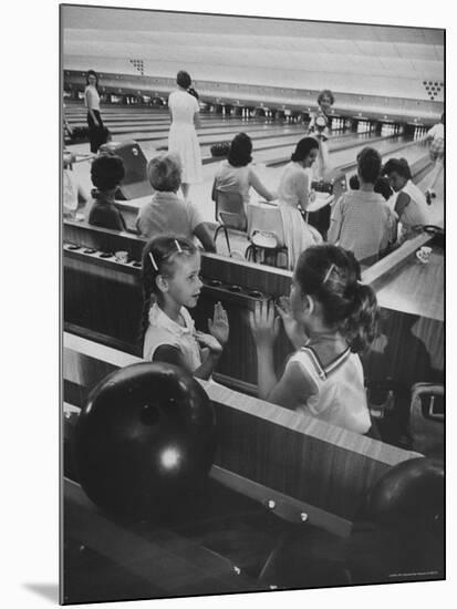 Children Entertaining Themselves While Their Mothers Compete in Bowling League-Stan Wayman-Mounted Photographic Print